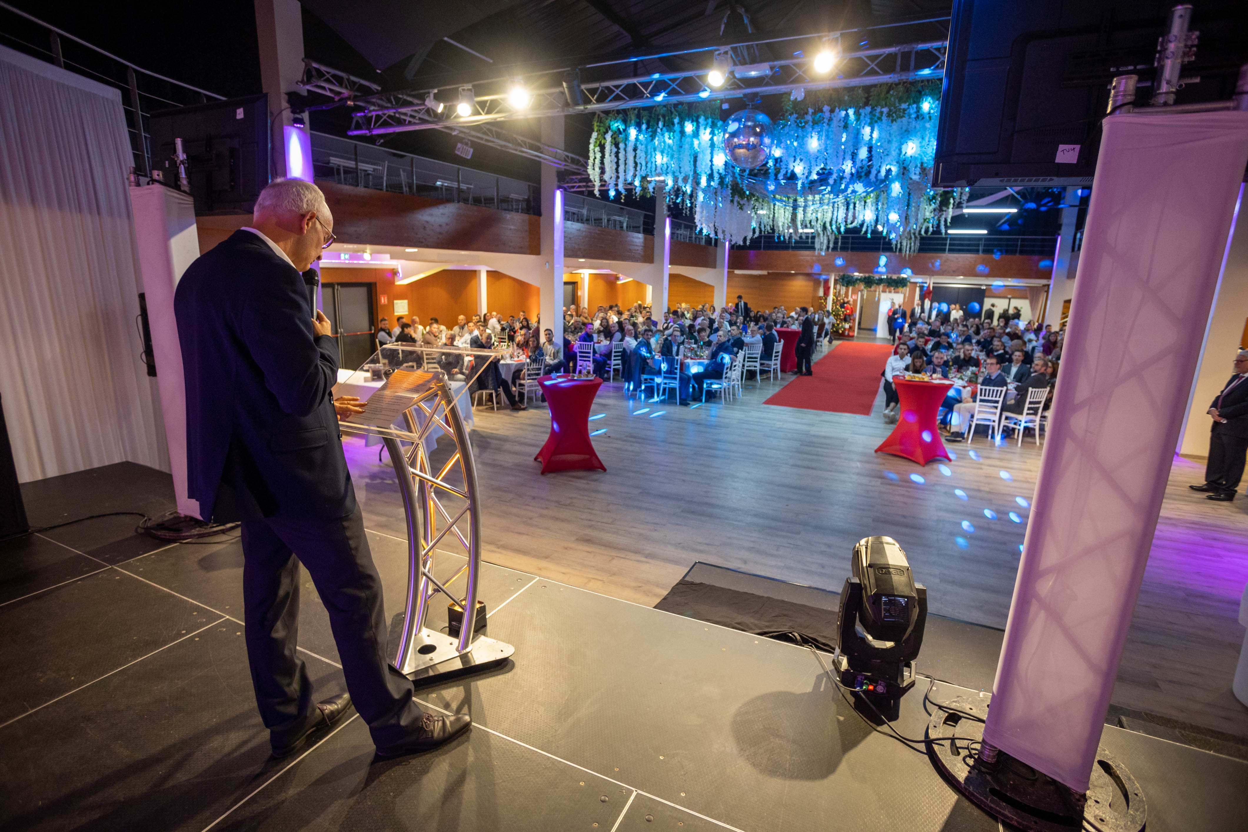 Stage design company Liege industrial venue exposed steel truss · INNOV'events