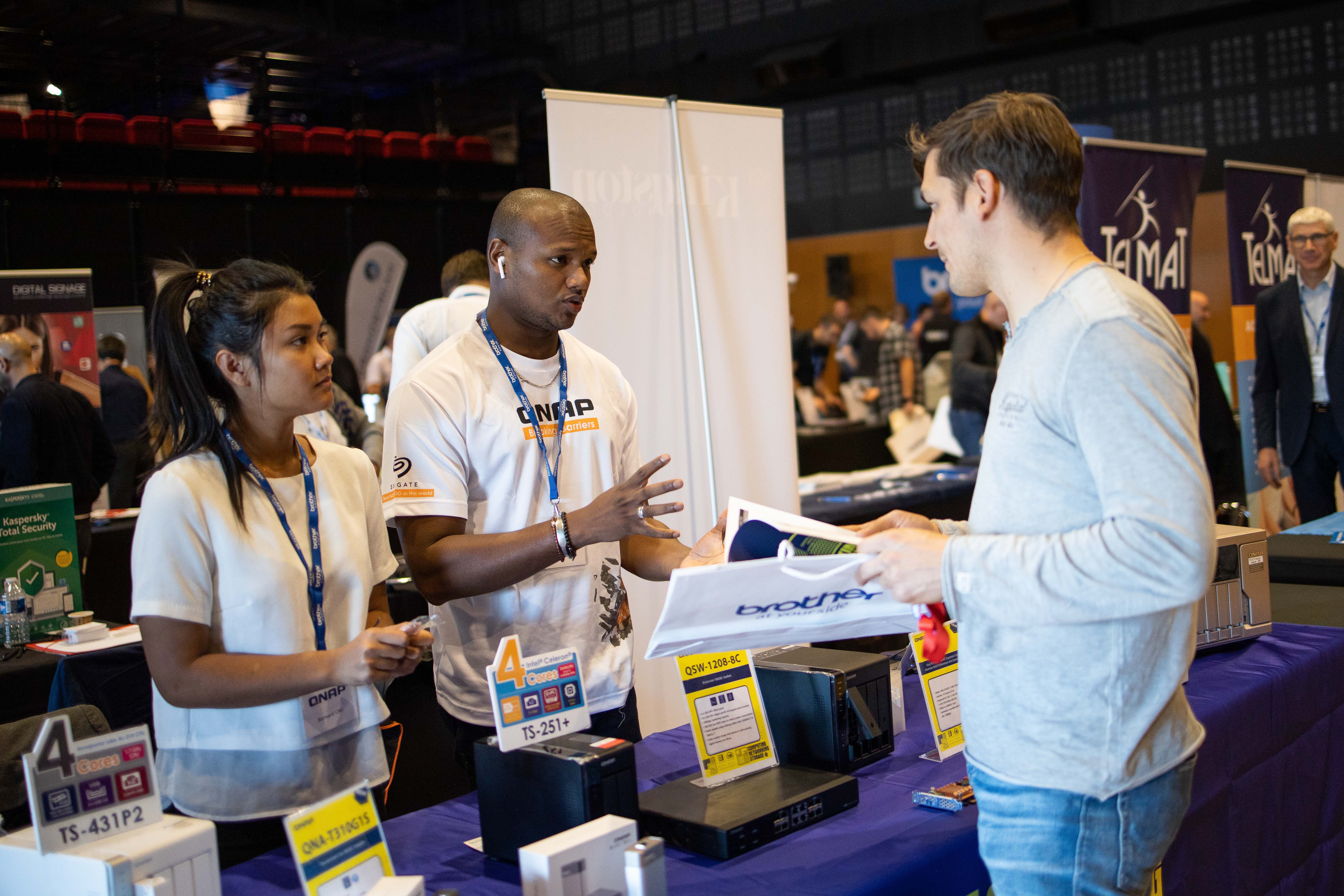 Hosted prize mechanic booth Liege Guillemins venue corporate event · INNOV'events